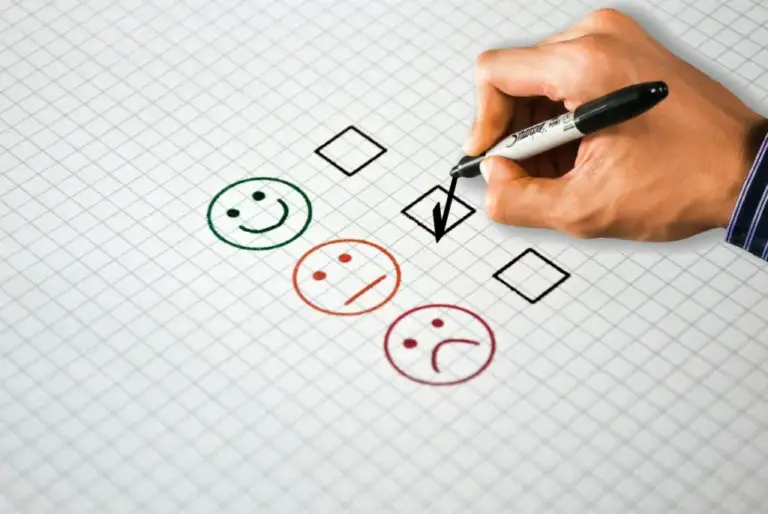 Person filling out a customer feedback survey on a laptop, illustrating customer feedback mistakes
