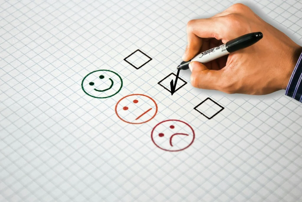 Person filling out a customer feedback survey on a laptop, illustrating customer feedback mistakes