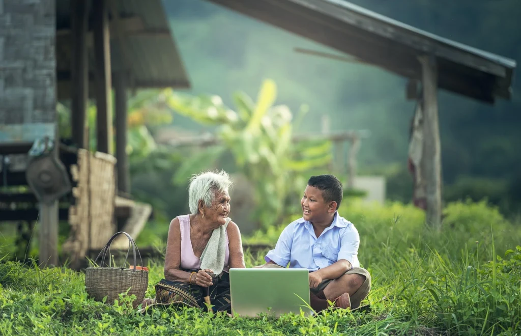 A happy customer using a laptop, demonstrating successful product adoption