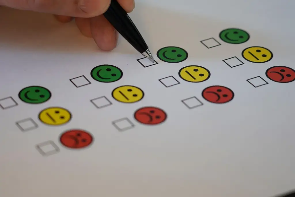 A person filling out a feedback form on a tablet, related to customer exit interviews